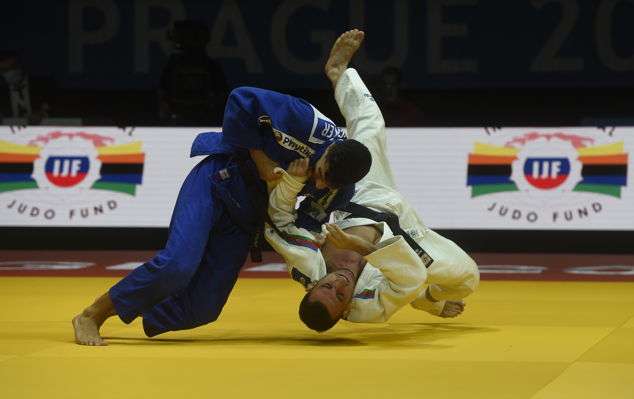 Orkhan Safarov, in white, was a surprise winner of the men's under-66kg title ©Getty Images