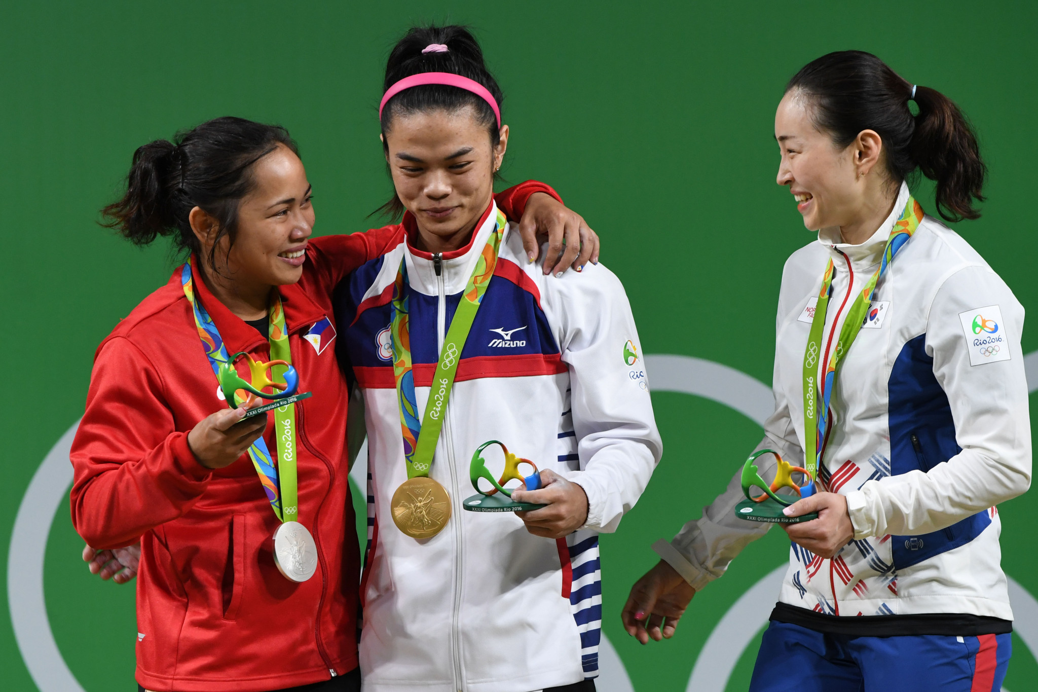 Hsu Shu-ching, centre, became the fifth Chinese Taipei athlete to secure an Olympic gold medal when she triumphed in weightlifting at Rio 2016 ©Getty Images