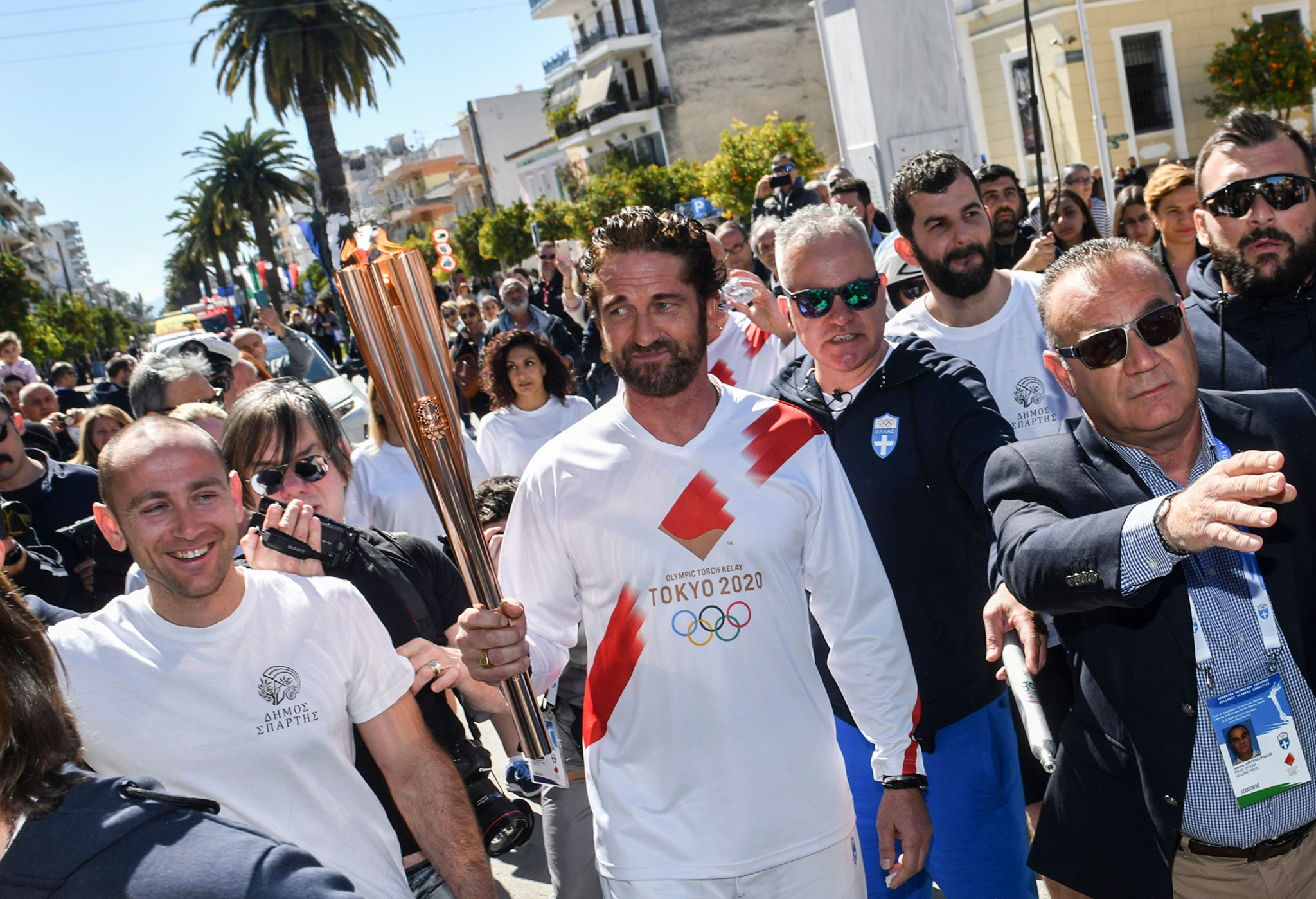 Gerard Butler attracted a dangerously large crowd when he carried the Olympic Flame in Greece in March ©Getty Images