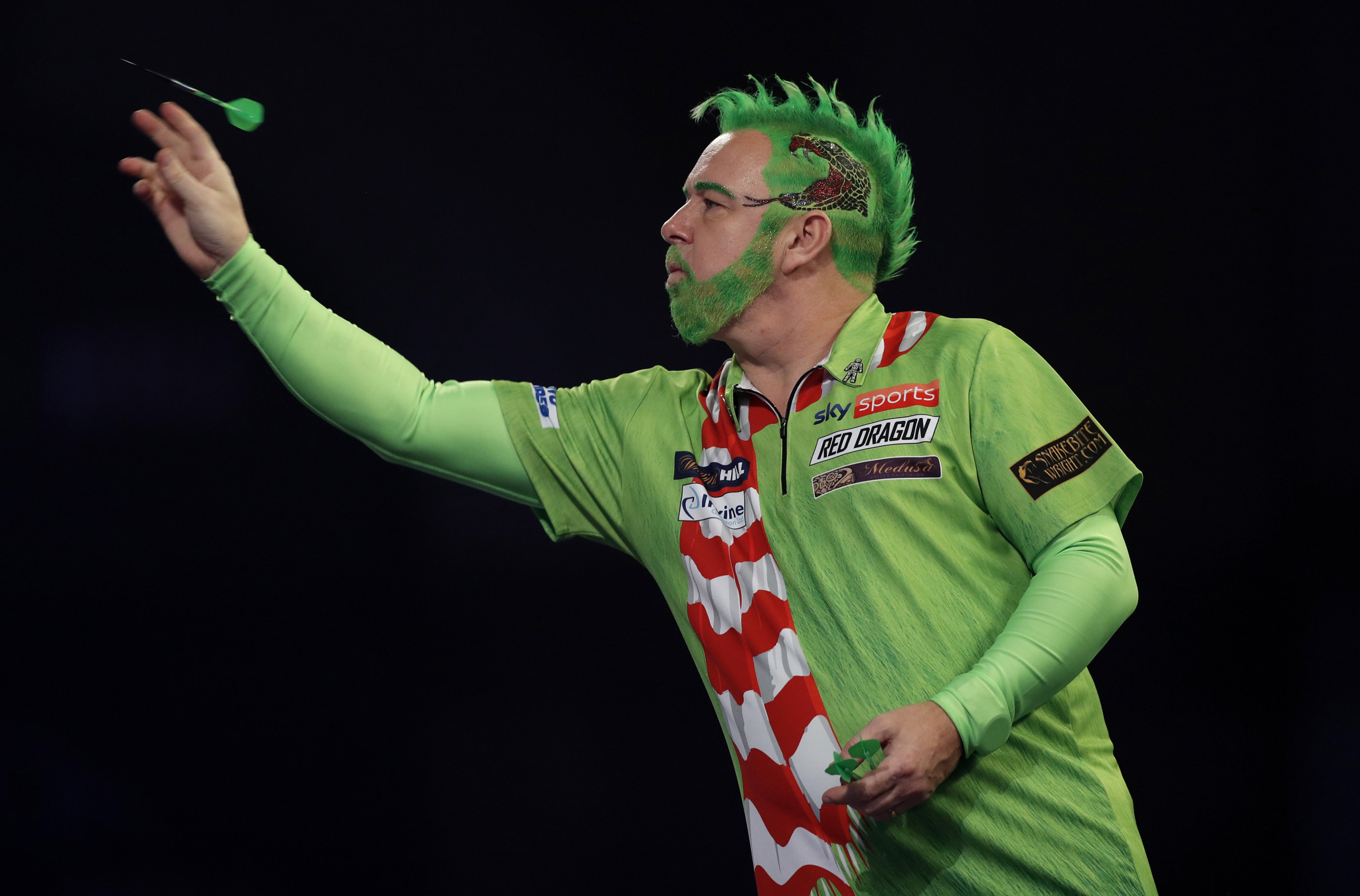 Defending champion Peter Wright is through to round three in London ©Getty Images