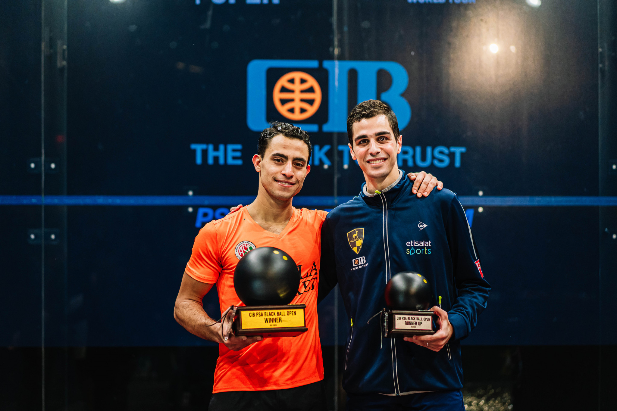 Fares Dessouky (left) and Ali Farag with their trophies following an epic five game CIB PSA Black Ball Open final in Cairo ©PSA World Tour