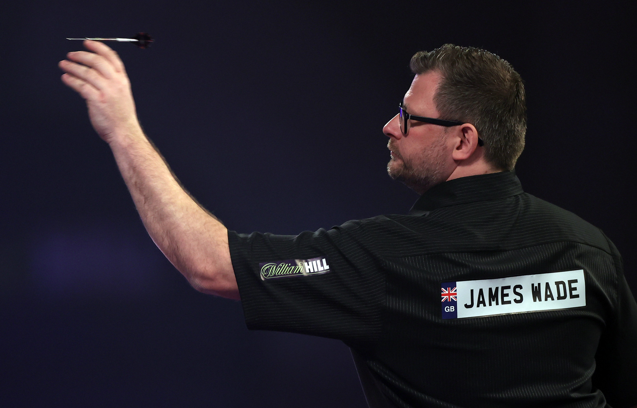 England's James Wade hit a nine-darter but was still defeated by Stephen Bunting during the third round of the PDC World Darts Championship ©Getty Images