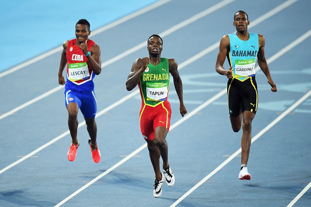 The Grenadian sprinter, centre, will not be able to return to competition until September 2026 ©Getty Images