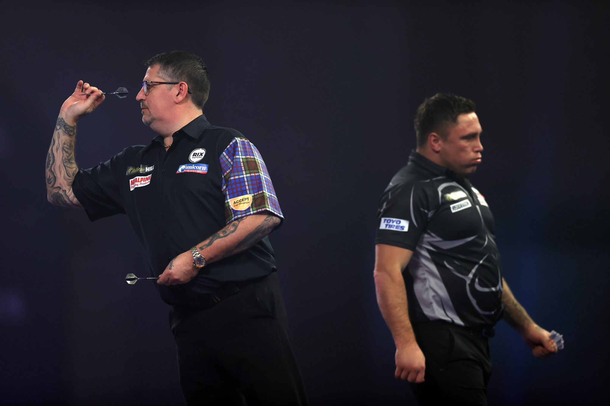 Gary Anderson (left) was aiming for a third PDC World Darts Championship title but could not live with Price ©Getty Images