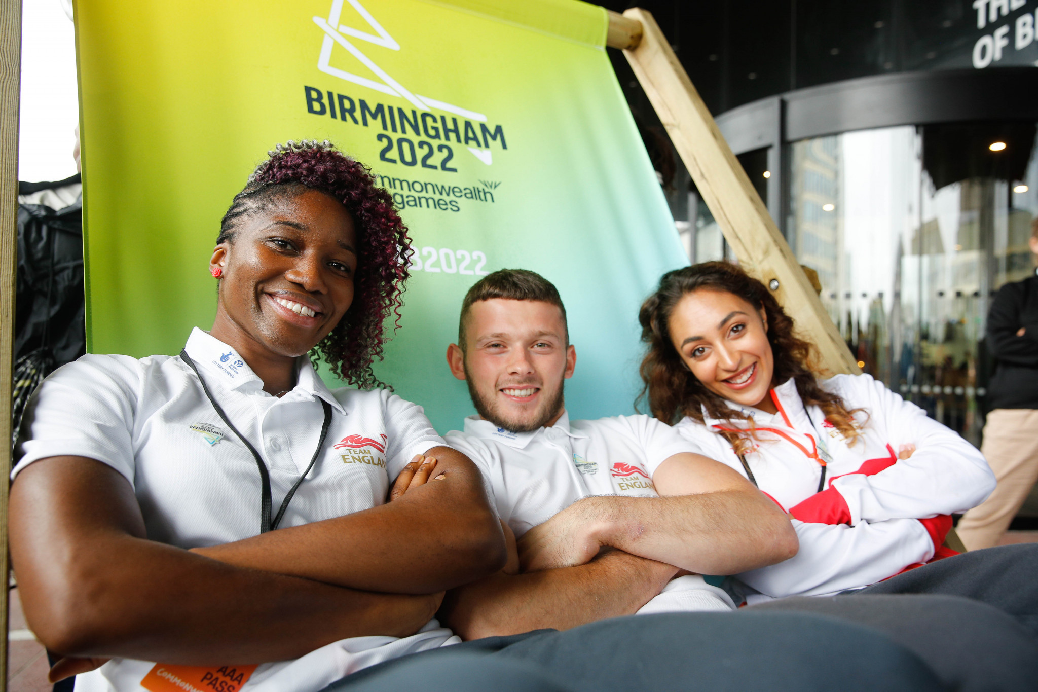 Team England netballer Ama Agbeze, gymnast Dom Cunningham and rhythmic gymnast Mimi Cesar promoting the Birmingham 2022 Commonwealth Games, which has just signed up local firm Cube International to design and sell its Games-related products ©Birmingham 2022