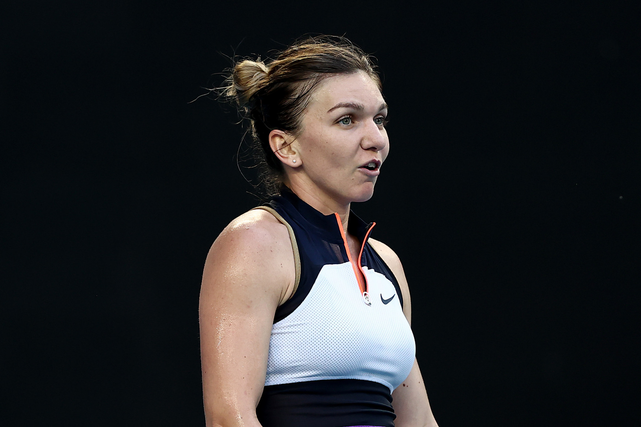Halep and Djokovic battle to second round wins at Australian Open