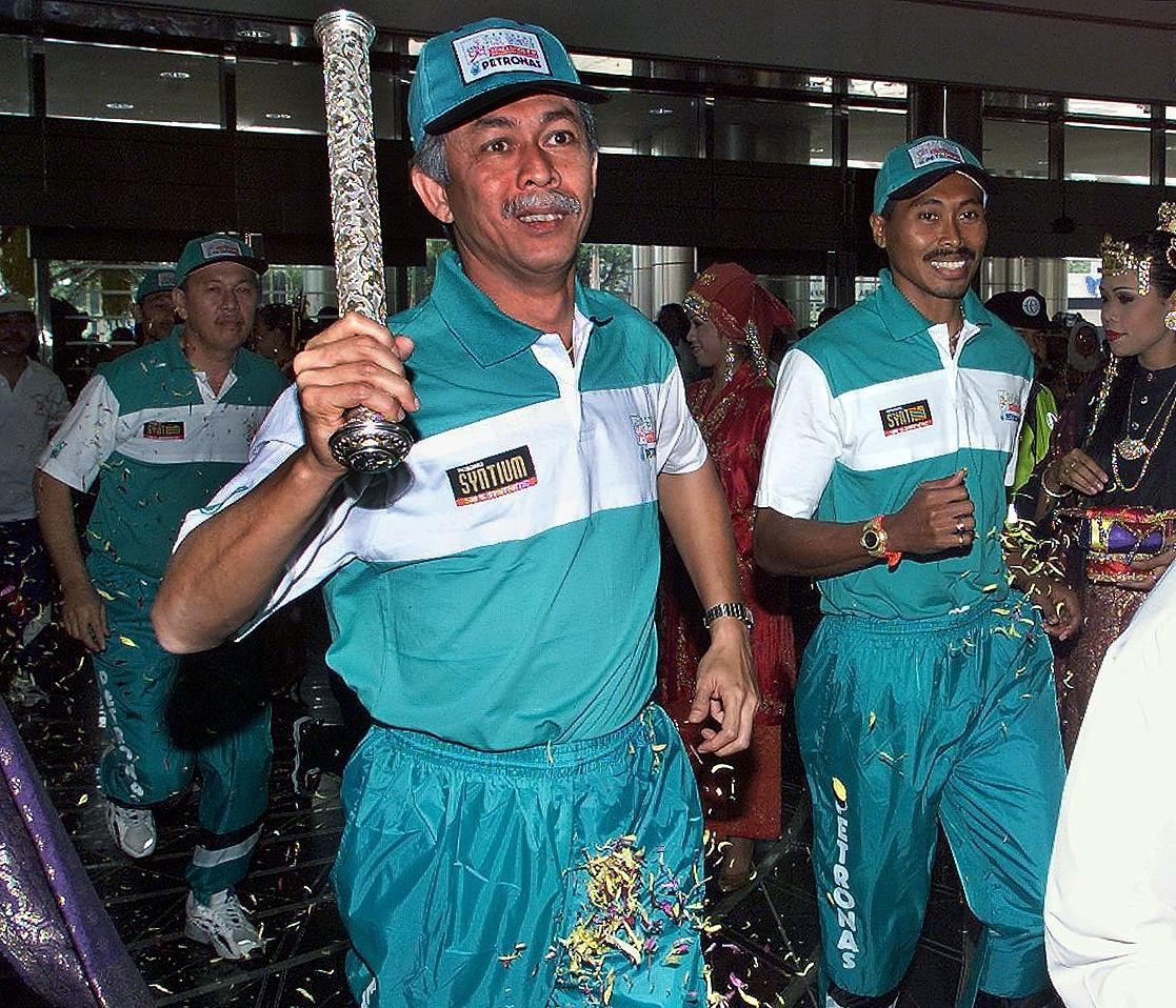 Mohamad Hassan Marica, President of Malaysian fuel giant Petronas, carried the 1998 baton ©Getty Images