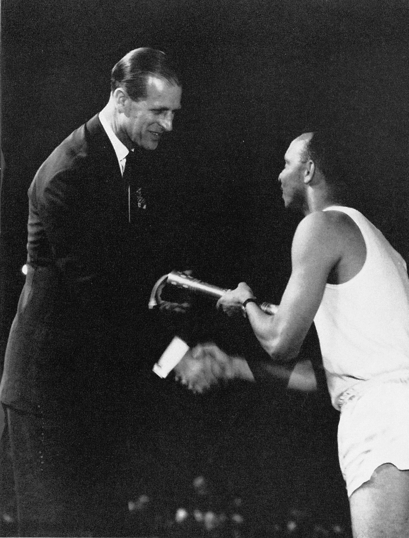 Keith Gardner hands the baton to Prince Philip at the Games in Jamaica ©Commonwealth Games Scotland