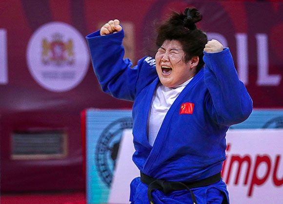 Xu Shiyan celebrates after winning the women's over-78kg category ©IJF
