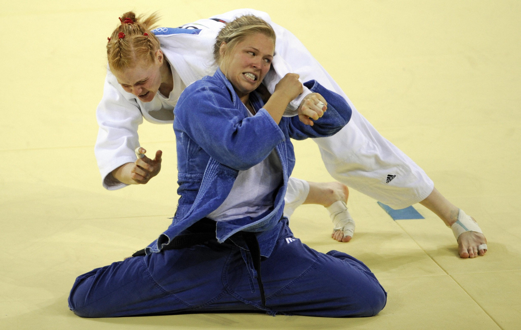 Ronda Rousey, in blue, is an Olympic judo medallist but far more famous for later endeavors  ©Getty Images