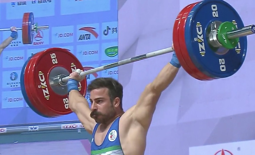 Rostami looks a picture of misery despite winning Asian weightlifting gold