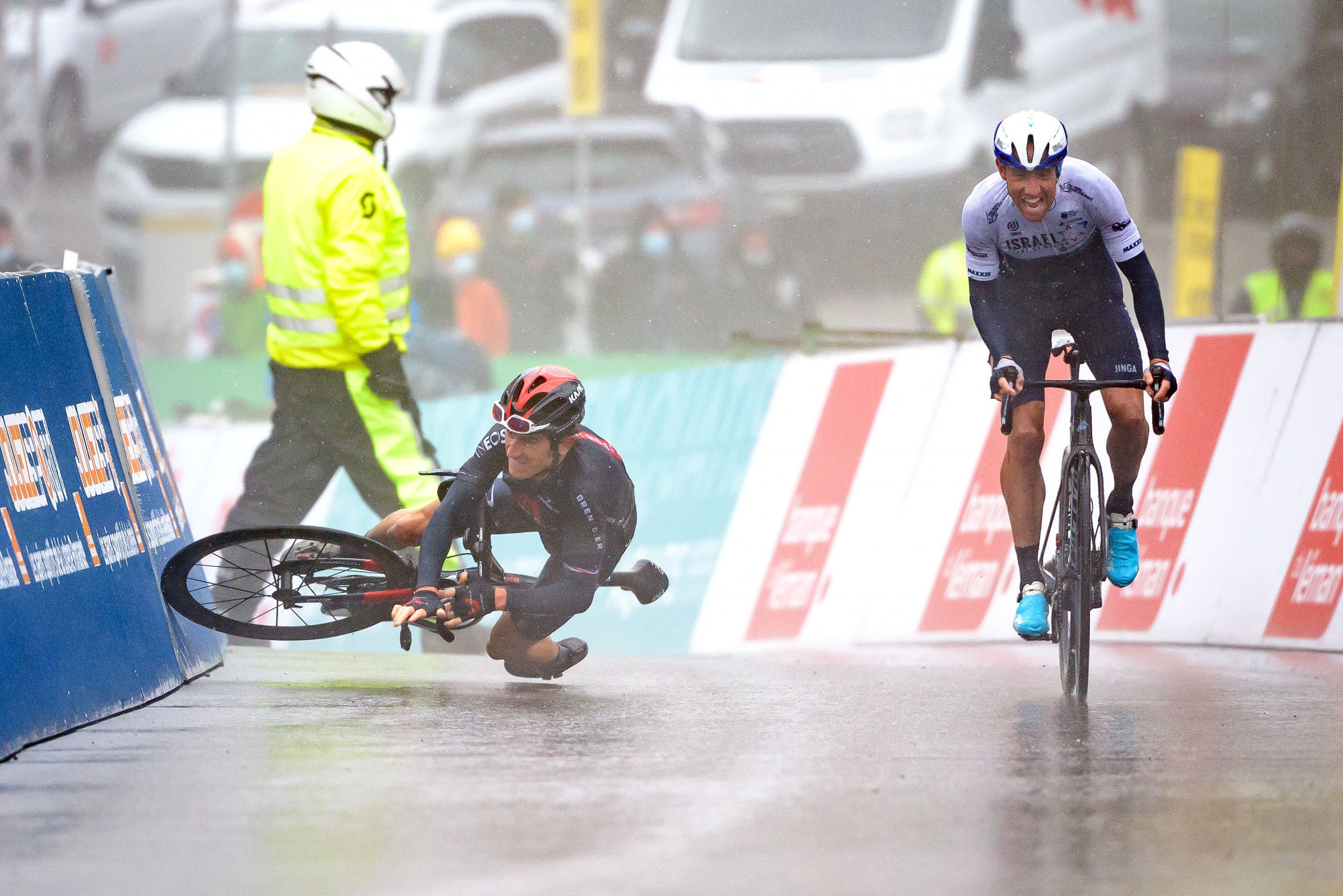 Geraint Thomas, left, crashed in the closing kilometre as Michael Woods earned the stage win at the Tour de Romandie ©Getty Images