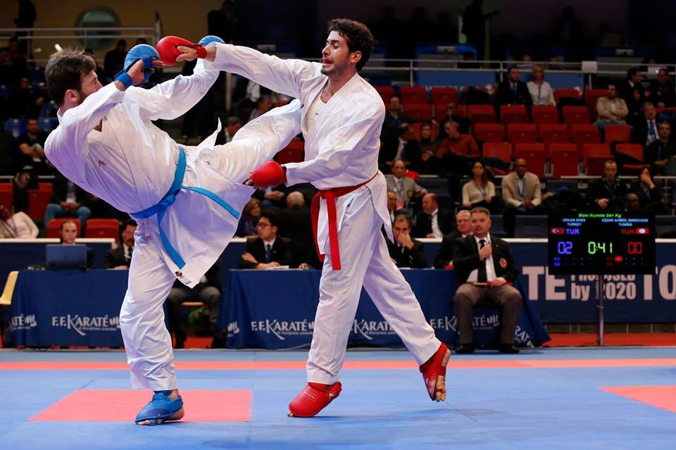 Turkey's Enes Erkan (blue) was one of the only world champions to book a place in the final as he progressed to the men's over 84kg gold medal bout ©Xavier Servolle/WKF