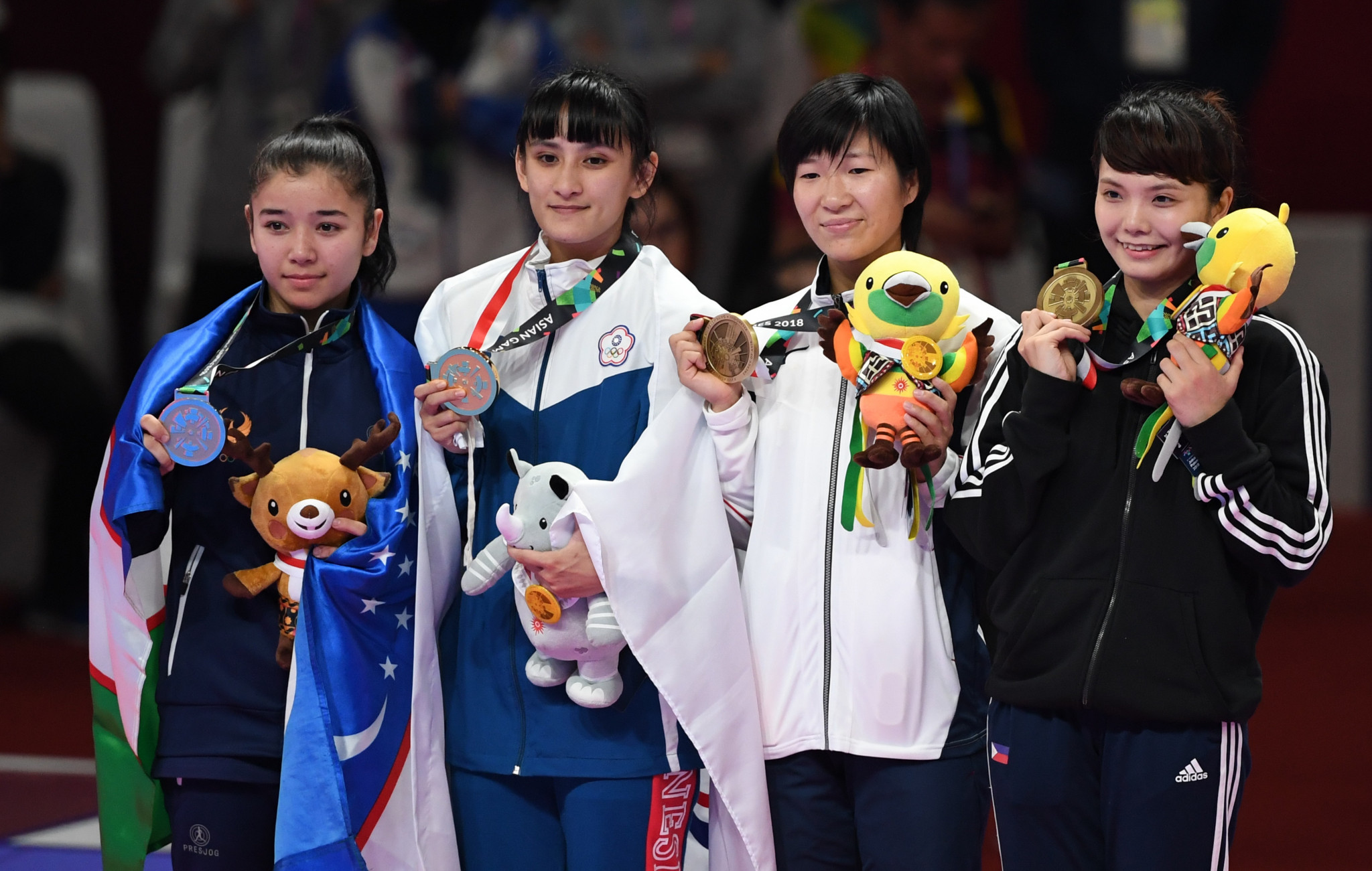 Junna Tsukii, far right, won a bronze medal at the 2018 Asian Games - the Philippines' only medal in the sport ©Getty Images