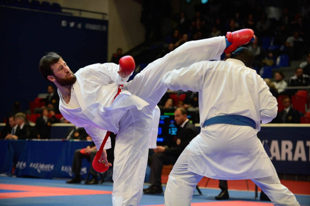 Turkey's Enes Erkan (red) justified his status as world champion by winning the men's over 84kg category