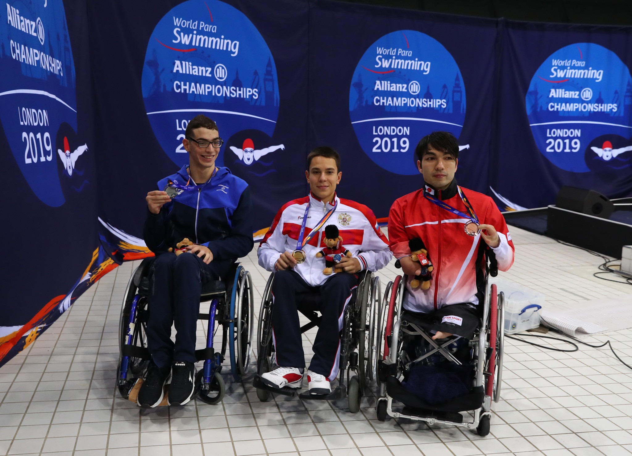 Ami Omer Dadaon, left, beat Roman Zhdanov, centre, and took the Russian's world record at the European Open Para Swimming Championships in Madeira ©Getty Images