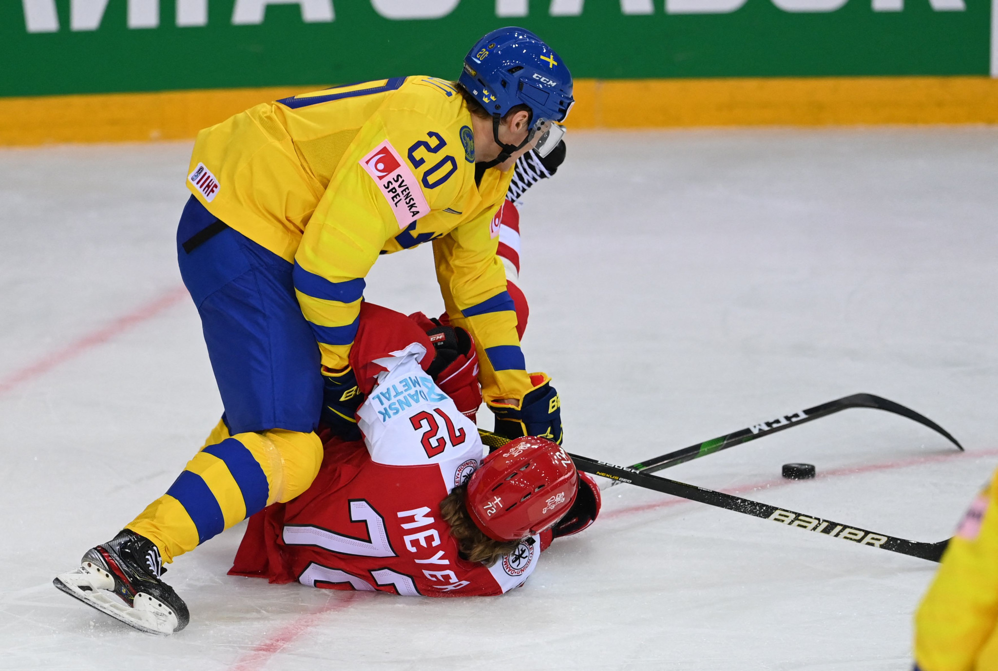 Denmark, in red, beat Sweden 4-3 in an entertaining game in Group A at the men's IIHF World Championship in Latvia ©Getty Images