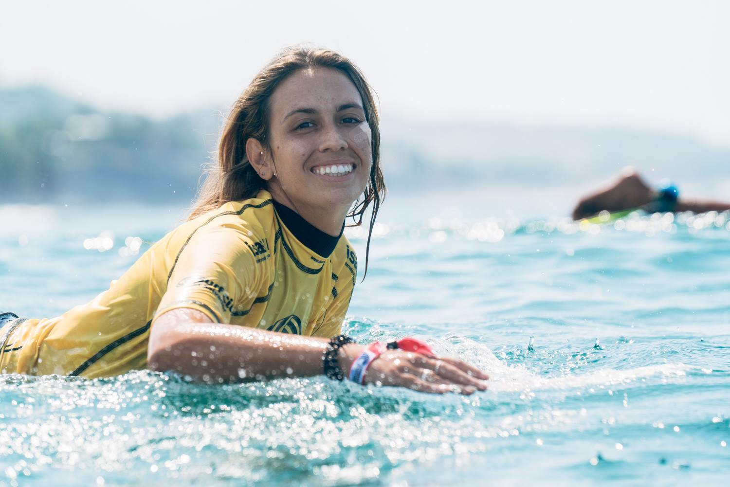 Chelsea Roett of Barbados is all smiles as she competes on the water ©ISA/Pablo Jimenez