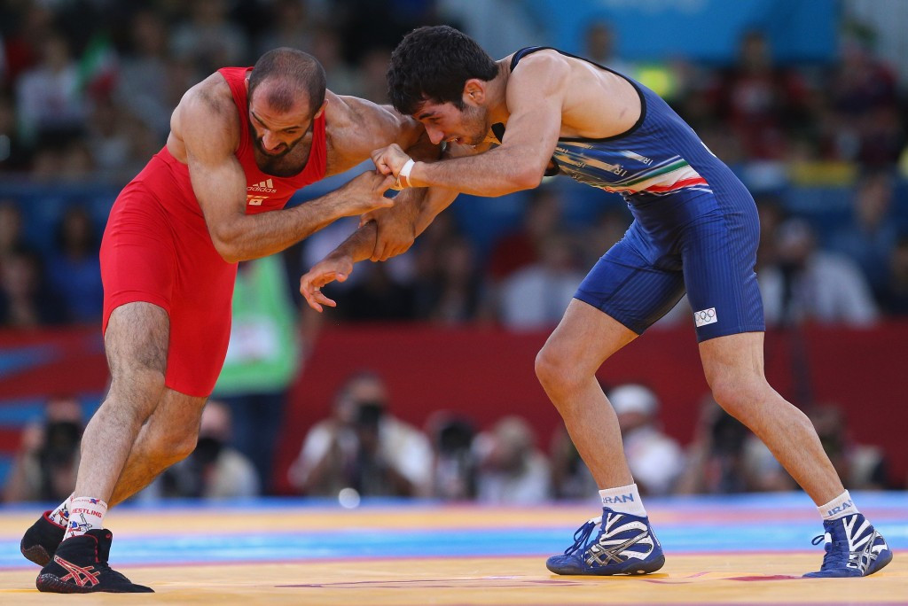 Omid Norouzi (right) was one of three male gold medal-winning wrestlers for Iran at London 2012