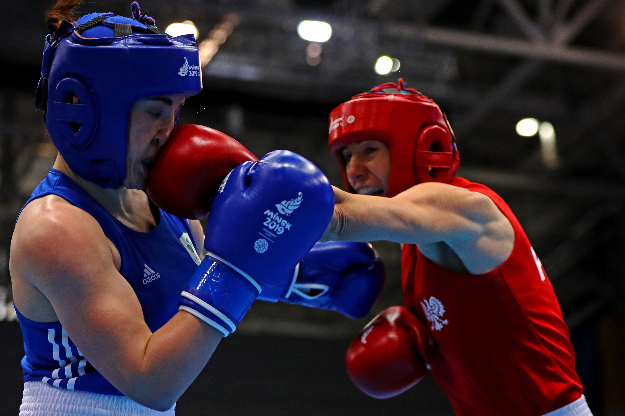 Karolina Koszewska of Poland, in red, is one win away from Tokyo 2020 after winning her semi-final in the women's welterweight category box-offs ©Getty Images