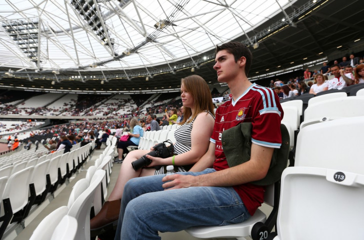 A West Ham United follower at last year's rugby friendly between Barbarians and Samoa gets a good look at the Olympic Stadium his team will take over - SOLELY - next season ©Getty Images