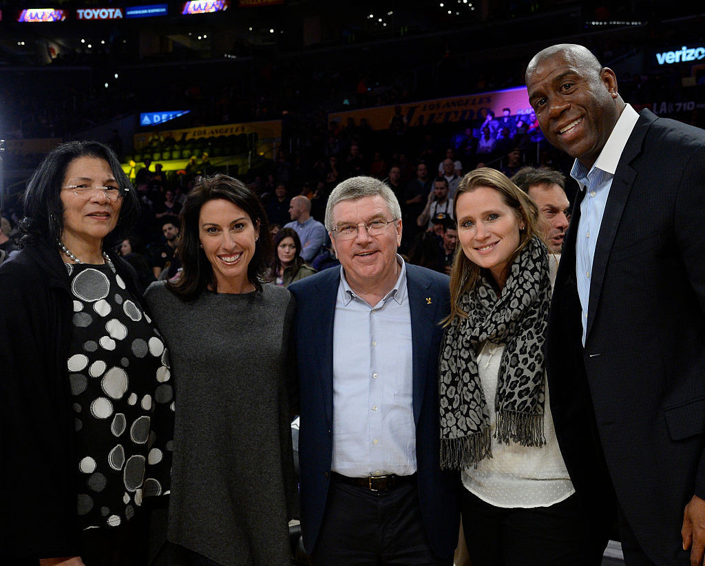 Ruggiero, pictured at an NBA game in 2016 with IOC President Thomas Bach and former player Magic Johnson, uncovered some interesting new trends in her Fan Project ©Getty Images