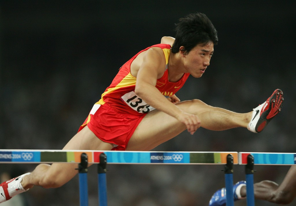 Liu Xiang, pictured en route to the 2004 Olympic 110m hurdles title, will officially mark his retirement tomorrow night at the IAAF Diamond League meeting in his native Shanghai ©Getty Images
