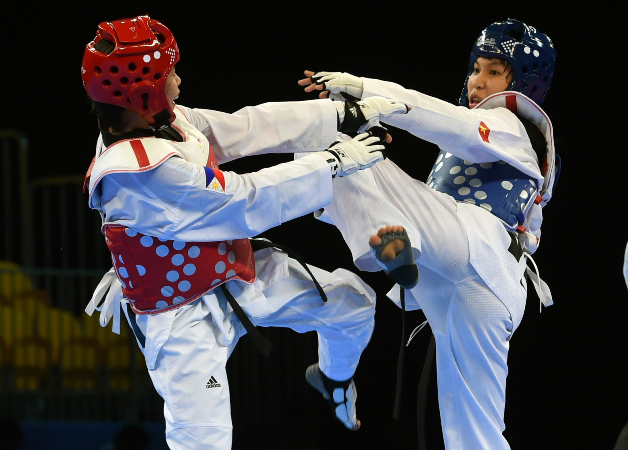 Trương Thị Kim Tuyến, right, heads into the Tokyo 2020 Olympics as Asian champion in the lightest category ©Getty Images