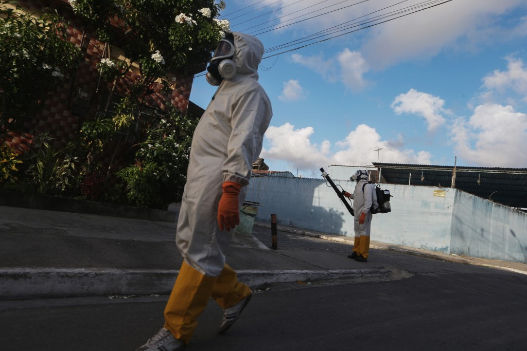 Health workers fumigate in an attempt to eradicate the mosquito which transmits the Zika virus