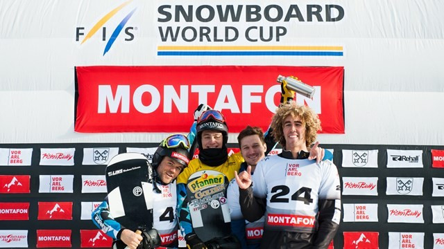 Nikolay Olyunin (second from right) celebrates on the snowboard cross sprint podium in Feldberg, Germany ©RIOU