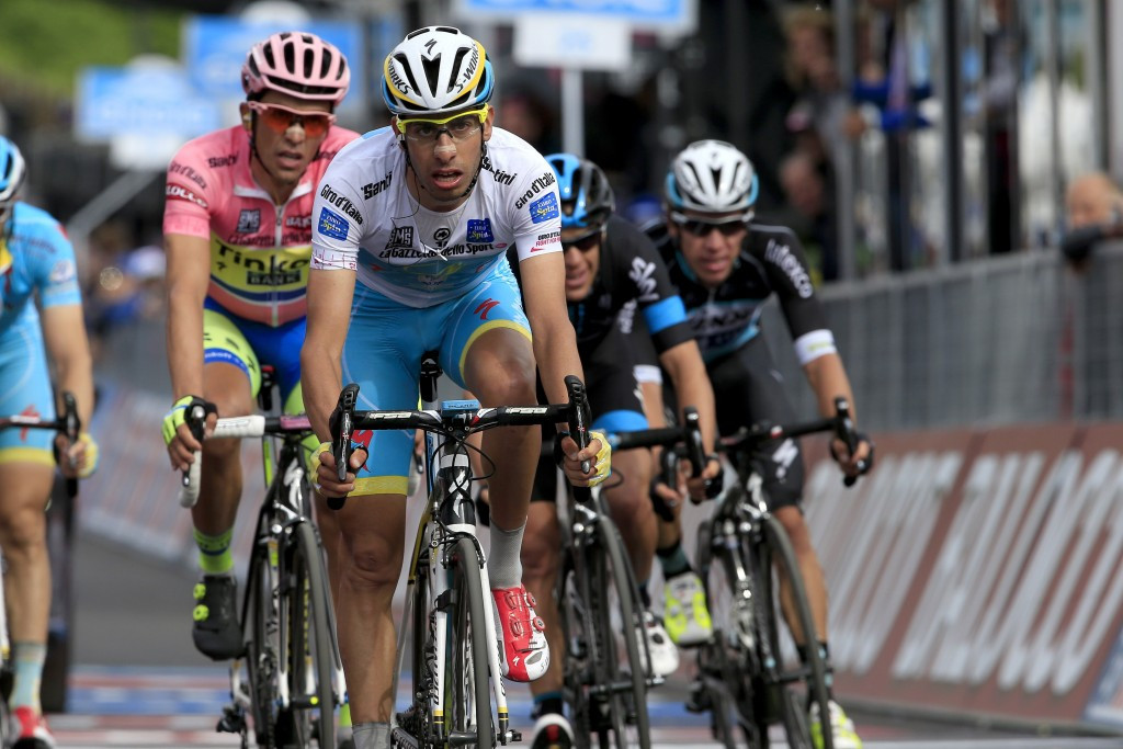Fabio Aru (white) trails race favourite Alberto Contador (pink) by four seconds in the overall classification