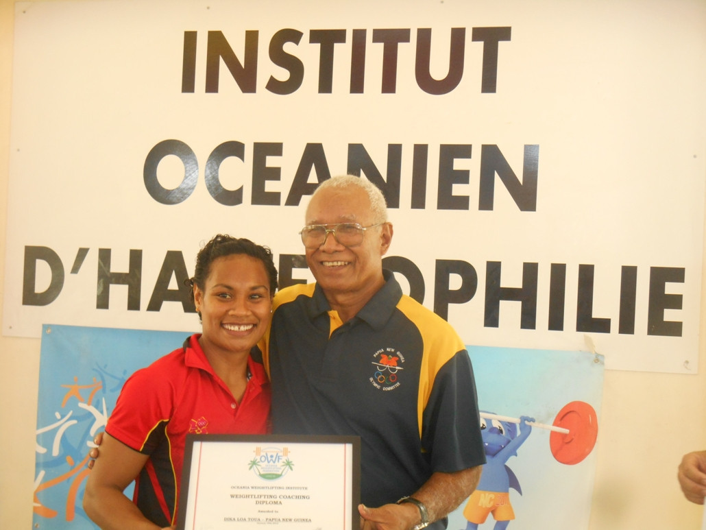 Dika, left, with Sir John Dawanincura, President of PNG’s National Olympic Committee and of its Weightlifting Federation ©OWI