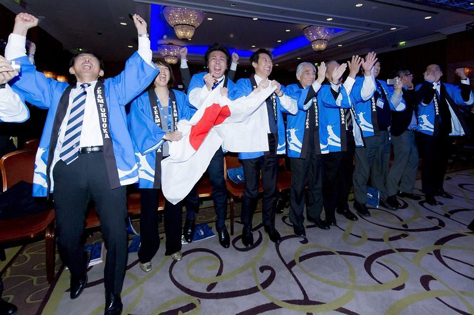 Fukuoka's delegation celebrate after being awarded the Championships ©FINA/Giorgio Scala