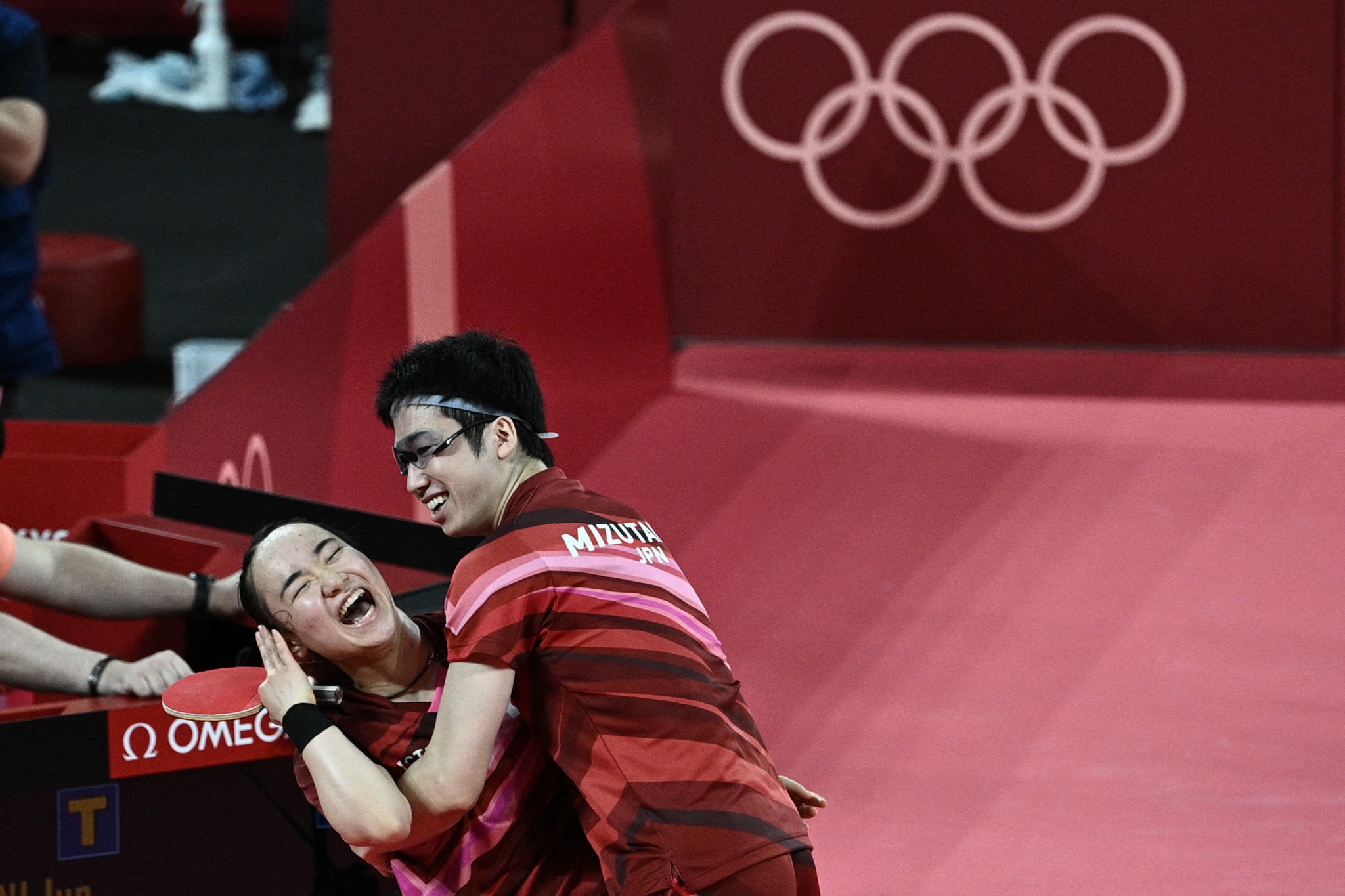 Jun Mizutani and Mima Ito celebrate their table tennis gold medal ©Getty Images