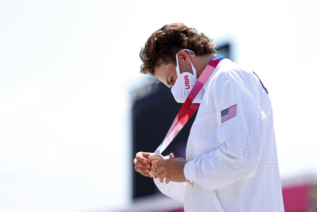 Jagger Eaton of the United States, bronze medallist in the first-ever Olympic skateboarding competition, inspects his medal with, well, all due respect ©Getty Images