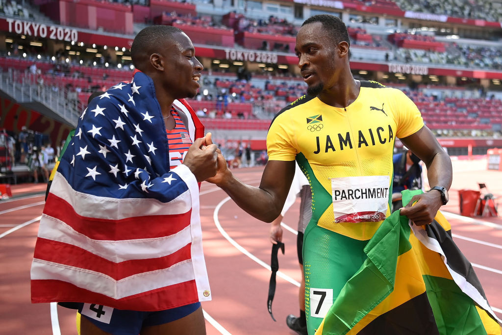 United States world champion Grant Holloway congratulates Jamaica's Hansle Parchment on his surprise victory in this morning's 110 metres hurdles final ©Getty Images