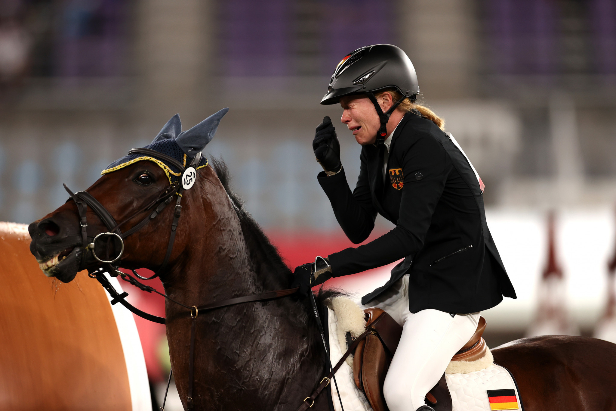 Germany's Annika Schleu broke down in tears after Saint Boy refused to jump in the riding event of the modern pentathlon ©Getty Images