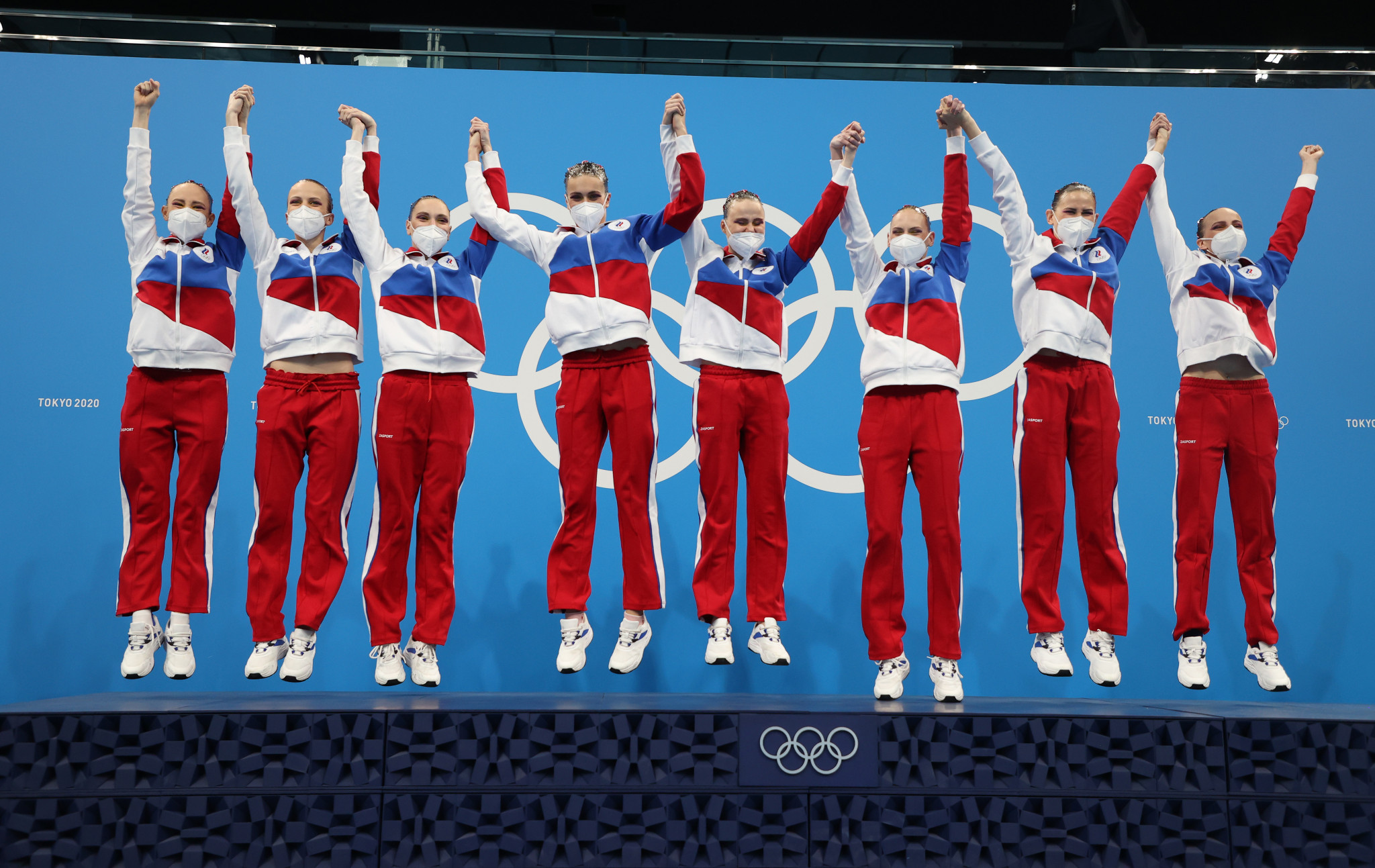 Russia jump for joy on the podium as they celebrate artistic swimming team gold ©Getty Images