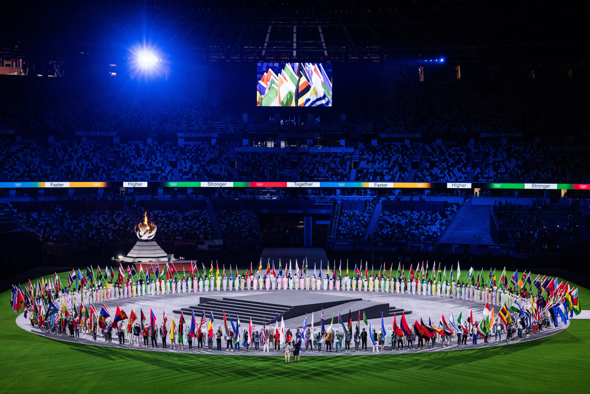 Flag bearers gathered in the centre of the field at the Olympic Stadium to celebrate the Closing Ceremony ©Getty Images