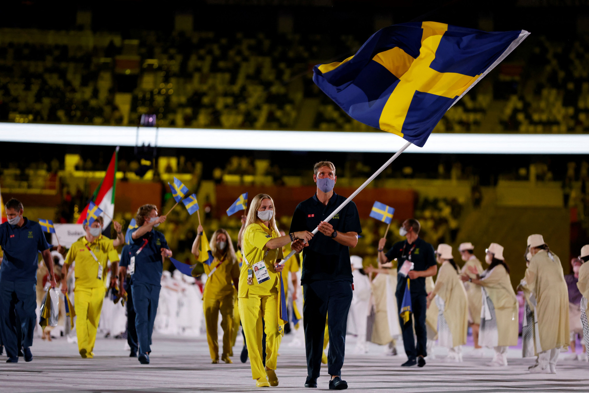 Sara Algotsson Ostholt and Max Salminen led Sweden in the Tokyo 2020 Parade of Nations ©Getty Images