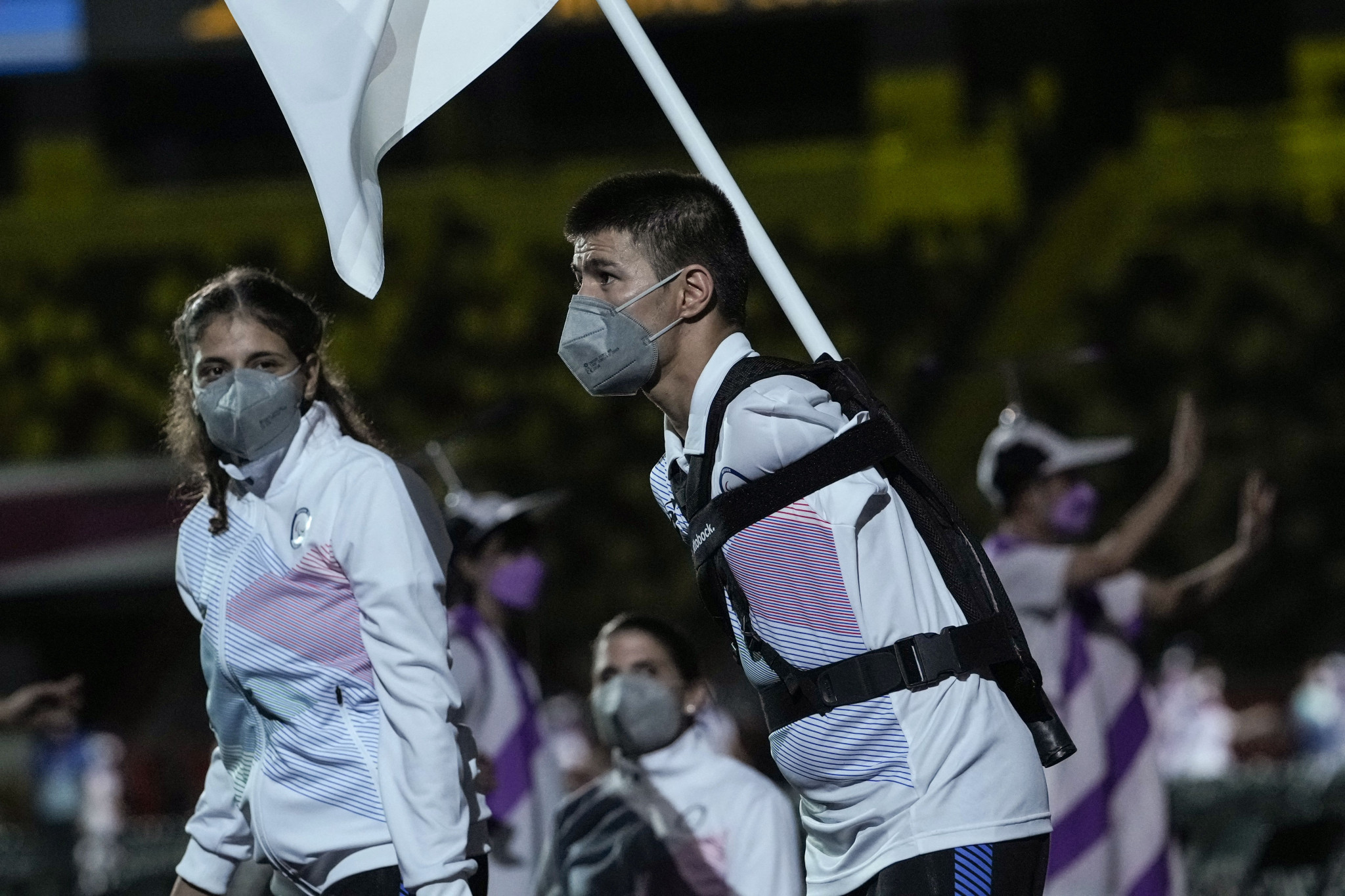 Alia Issa and Abbas Karimi were the flagbearers for the first official Refugee Paralympic Team at the Tokyo 2020 Paralympics Opening Ceremony ©Getty Images