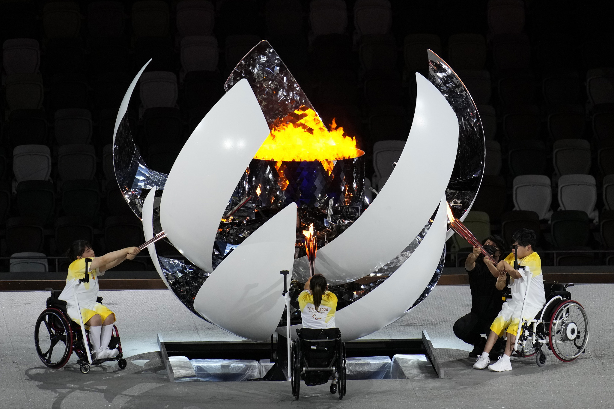 Karin Morisaki, left, Yui Kamiji, centre and Shunsuke Uchida, right, were the athletes given the honour of setting the Cauldron alight during the Paralympics Opening Ceremony ©Getty Images