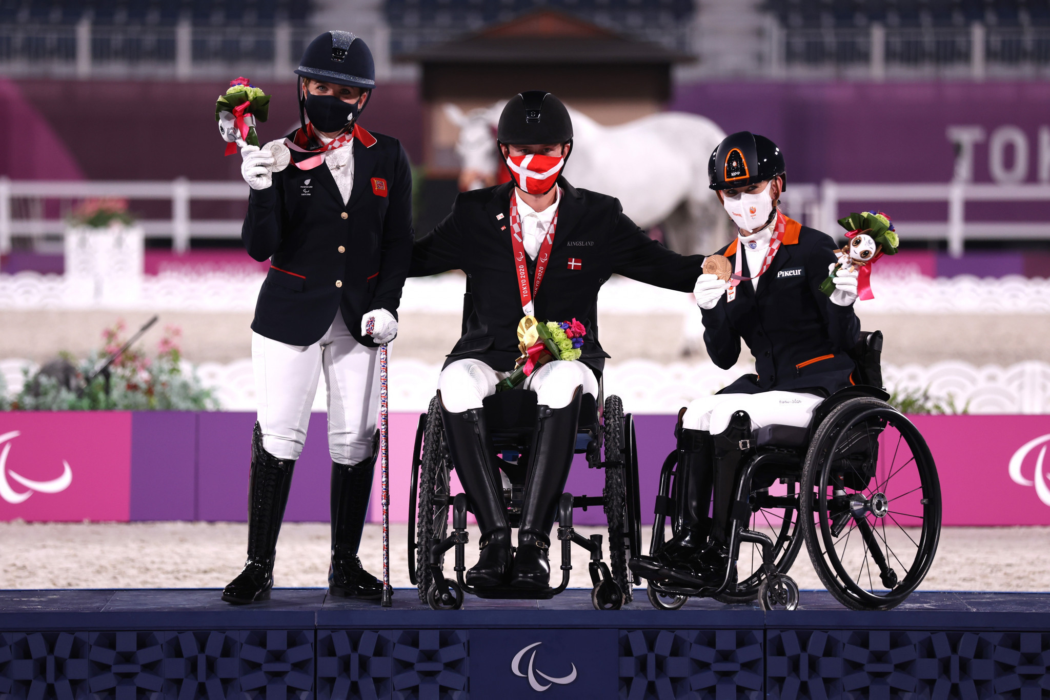 Denmark’s Tobias Thorning Joergensen, centre, secured his maiden Paralympic gold medal, with Natasha Baker, left, second and Rixt van der Horst third in the grade III individual test ©Getty Images