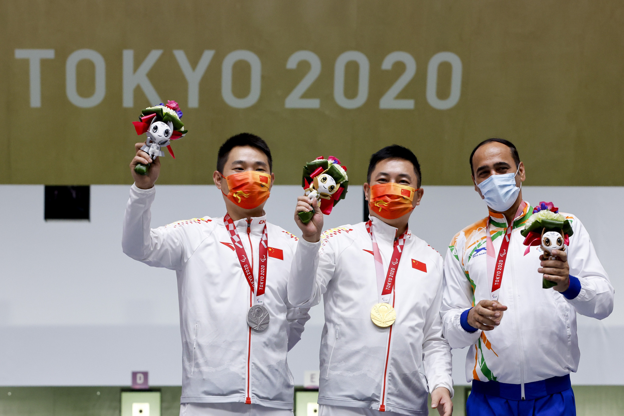 Yang Chao, centre, tops the podium as Huang Xing, left, and Singhraj, right, collect silver and bronze respectively ©Getty Images
