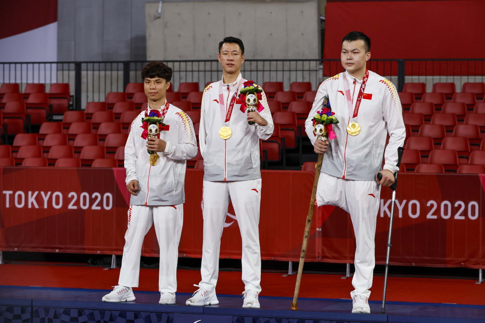 China celebrate their gold medals in the men's team 6-7 classes competition after beating Britain in the final ©Getty Images