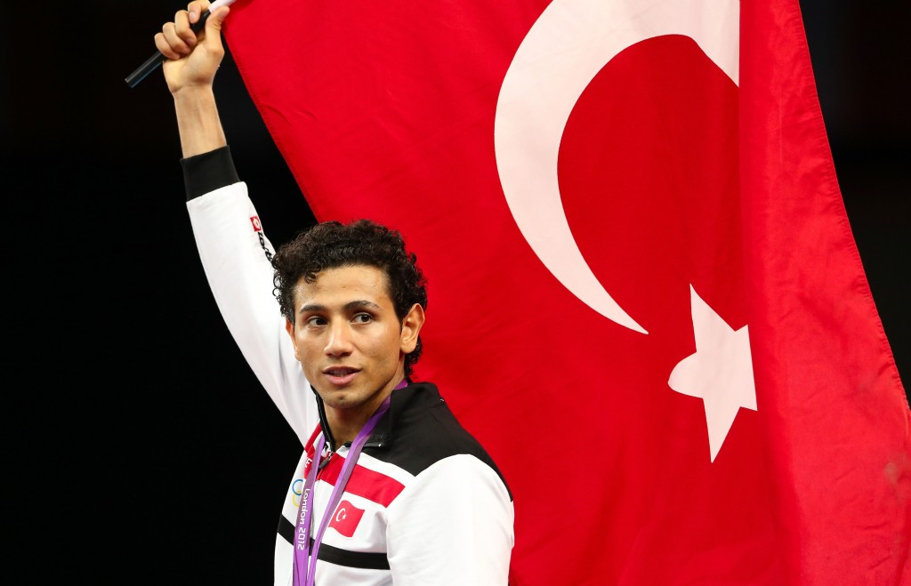 Servet Tazegul poses with the Turkish flag after winning the Olympic gold medal at London 2012 ©Getty Images
