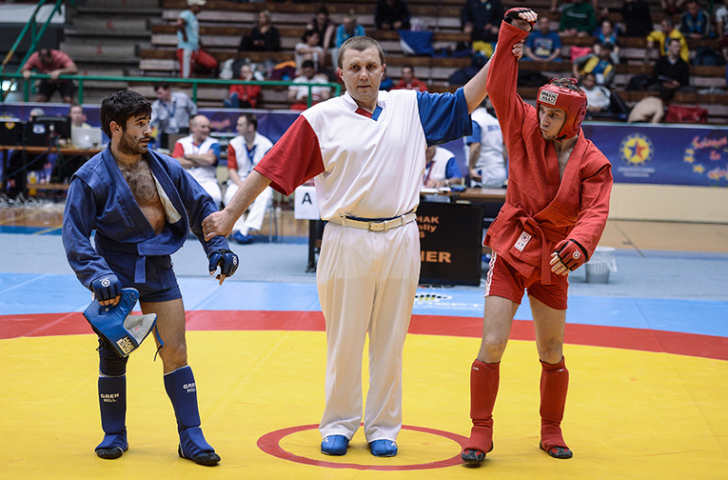 Russia's Anatoliy Stishak (right) triumphed in the combat men's 52kg category
