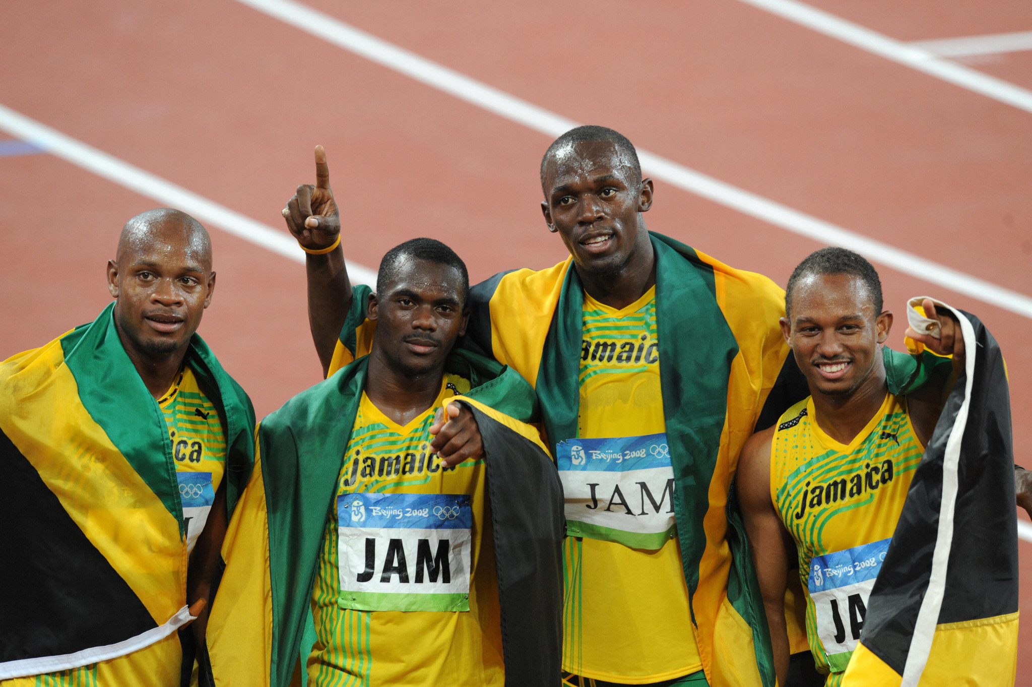 From left to right, Asafa Powell, Nesta Carter, Usain Bolt and Michael Frater, celebrate their 4x100m gold medal at the Beijing 2008 Olympics ©Getty Images