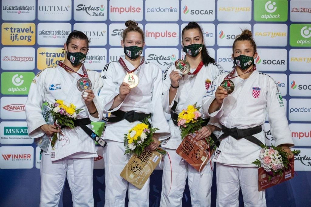 Joanne Van Lisehout, second left, triumphed in the women's under-63kg event, with Umalt Demirel, left, clinching silver ©IJF