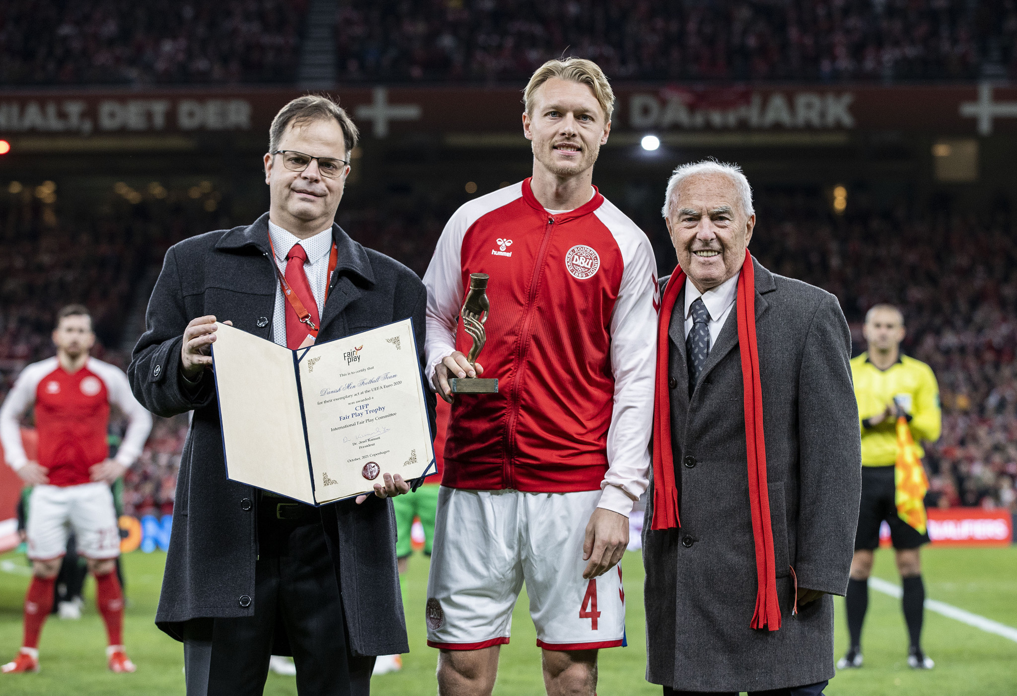 Denmark captain Simon Kjær received the award on behalf of the team ©CIFP